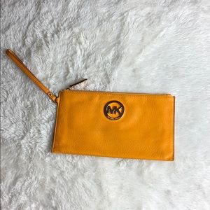 Mustard Michael kors envelope wristlet